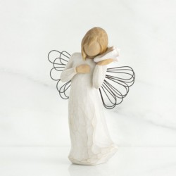 Small angel figurine holding phone to her ear