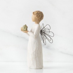 Angel figurine holding tea pot