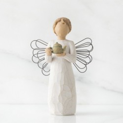 Angel figurine holding tea pot