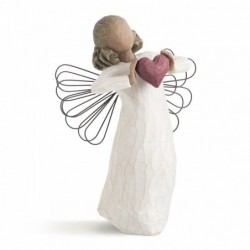 Faceless woman angel figurine wearing white dress holding pink heart up