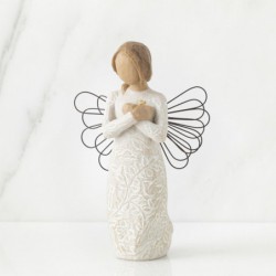 Angel figurine in white dress with black wire wings holding arms crossed on her chest