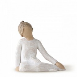 Faceless girl figurine sitting with hands on her legs