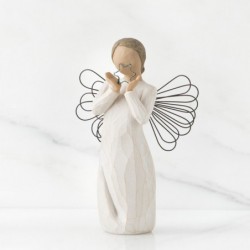 Angel figurine holding up blue sparkly star