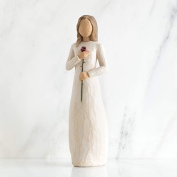 Woman figurine holding a rose in her hand