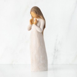  standing female figure in cream dress