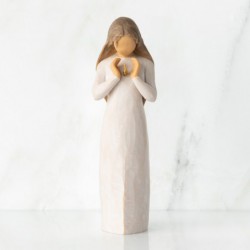  standing female figure in cream dress