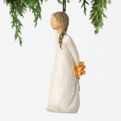  holding bouquet of orange flowers behind back. Hook and loop affixed to head