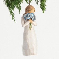 holding bouquet of blue forget-me-not flowers to face. Hook and loop affixed to head