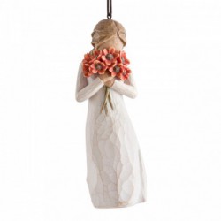 Figure in cream dress holding large bouquet of red-orange poppies up to face