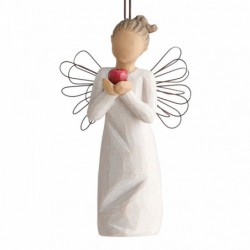 Front view of figure in cream dress with wire wings holding large red apple in hands